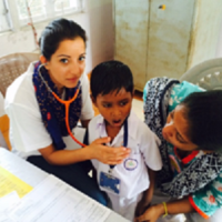 Doctor at MCC Medical camp examines Khelaghar students