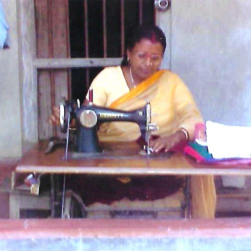 Woman sewing clothes for a living