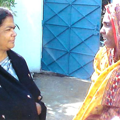 Mita Guha in conversation with a beneficiary of the Self Help Group